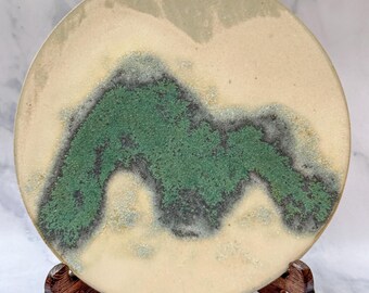 Wood Fied Ceramic Disc with Green Mountain Design, Earthy Beige Tone and Unique Textures, Decorative Ceramic Wall Art with Display Stand