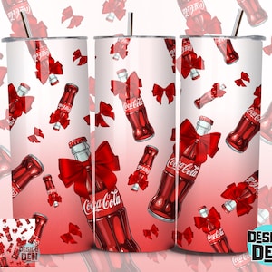 May include: A set of three stainless steel tumblers with a red and white Coca-Cola design. The design features red bows and Coca-Cola bottles. The tumblers have a straw and a lid. A matching coaster is also included.