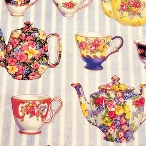 May include: Fabric with a repeating pattern of teacups and teapots. The teacups and teapots are decorated with floral designs in shades of pink, yellow, and blue. The background has vertical white and light blue stripes. The text "Loving Touch Fabrics" is in the bottom right corner.