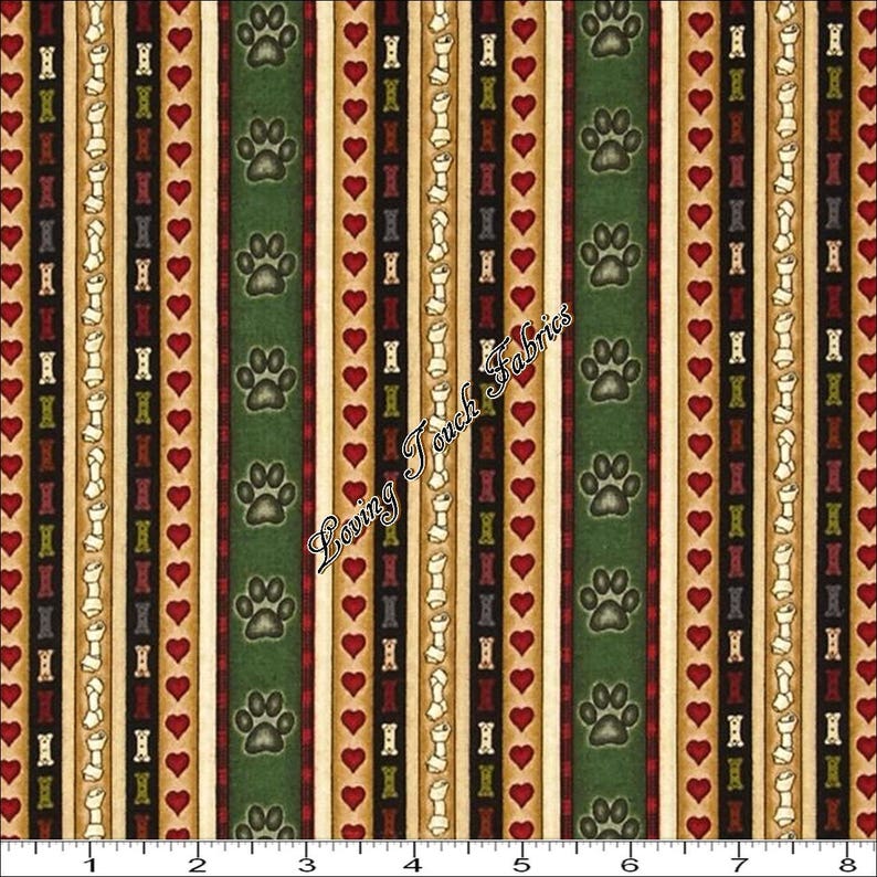 May include: A fabric with a repeating pattern of green, brown, red, and white stripes. The stripes feature paw prints, hearts, and bone shapes. The fabric is labeled "Loving Touch Fabrics".