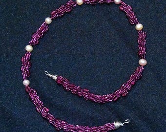 purple spiral cord and pink pearl necklace