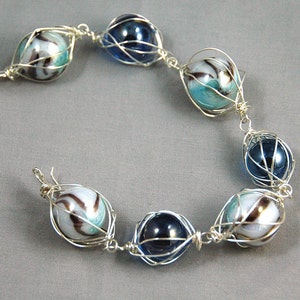 Bright aqua blue and swirl caged marble bracelet