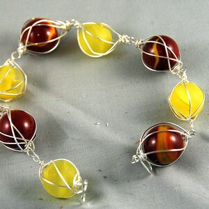Hot red and yellow caged marble bracelet