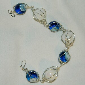 white and blue with white swirl caged marble bracelet