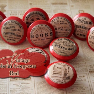 May include: A collection of vintage red knobs with various labels, including "Books," "Clothing," and "Photographs." The image also features a red label that reads "Vintage Knobs in Gorgeous Red."