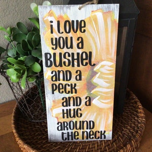 I love you a bushel and a peck and a hug around the neck sunflower sign hand painted rustic sunflower sign with phrase image 1