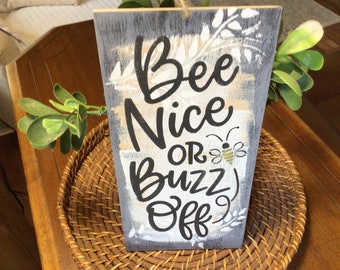 Bee nice or buzz off sign
