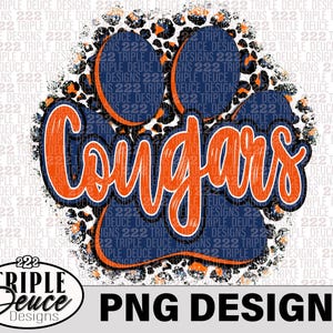 May include: Orange and blue paw print with the word "Cougars" in white text. The paw print is on a white background with a leopard print pattern.