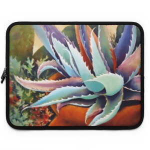 May include: A close-up of a blue and purple succulent plant with sharp, pointed leaves in a terracotta pot. The plant is in focus, while the background is blurred.