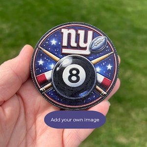 May include: A round patch featuring a black eight ball, the letters "ny" in white, and a football. The background is blue with white stars. Crossed pool cues and red and white stripes complete the design.