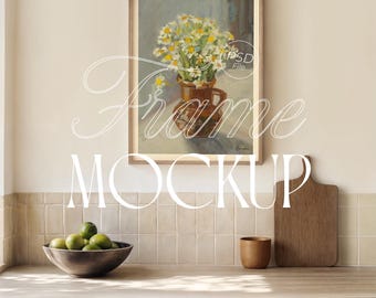 May include: A framed art print featuring a still life of white and yellow flowers in a brown vase. The frame is a light brown color. The words "Frame Mockup" are written in a script font over the image. The text "DIN A & EASY TO USE" is at the top.