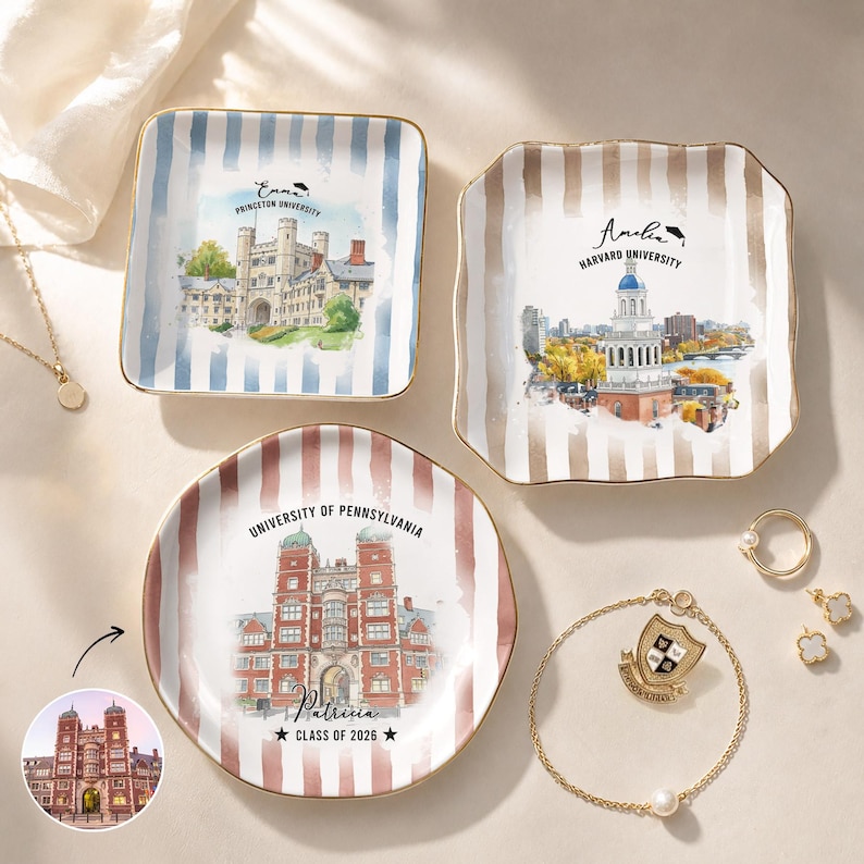 May include: Three decorative ceramic dishes with gold rims, featuring watercolor illustrations of university buildings. One dish has blue stripes and the Princeton University logo. Another has brown stripes and the Harvard University logo. The third has red stripes and the University of Pennsylvania logo.