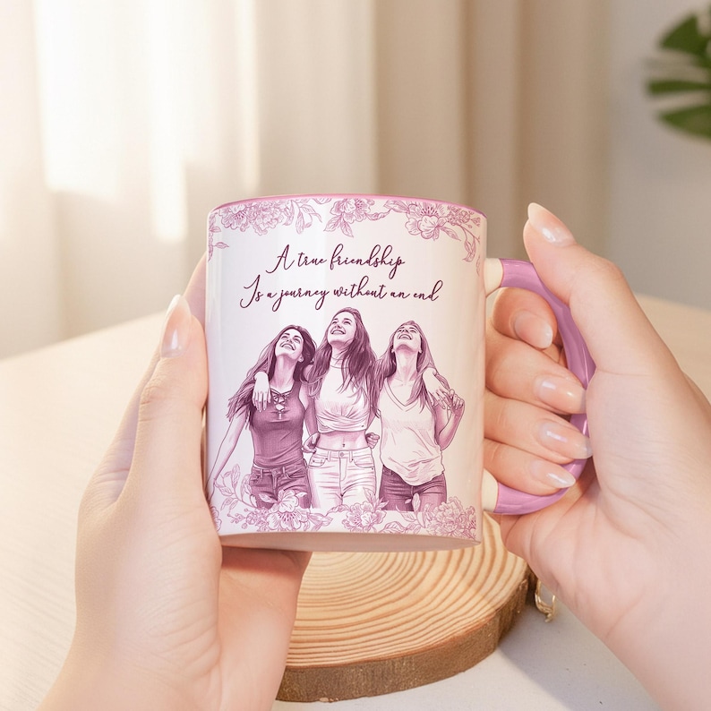 May include: White ceramic mug with a purple handle and floral design. The mug features a sketch of three people and the text "A true friendship is a journey without an end."