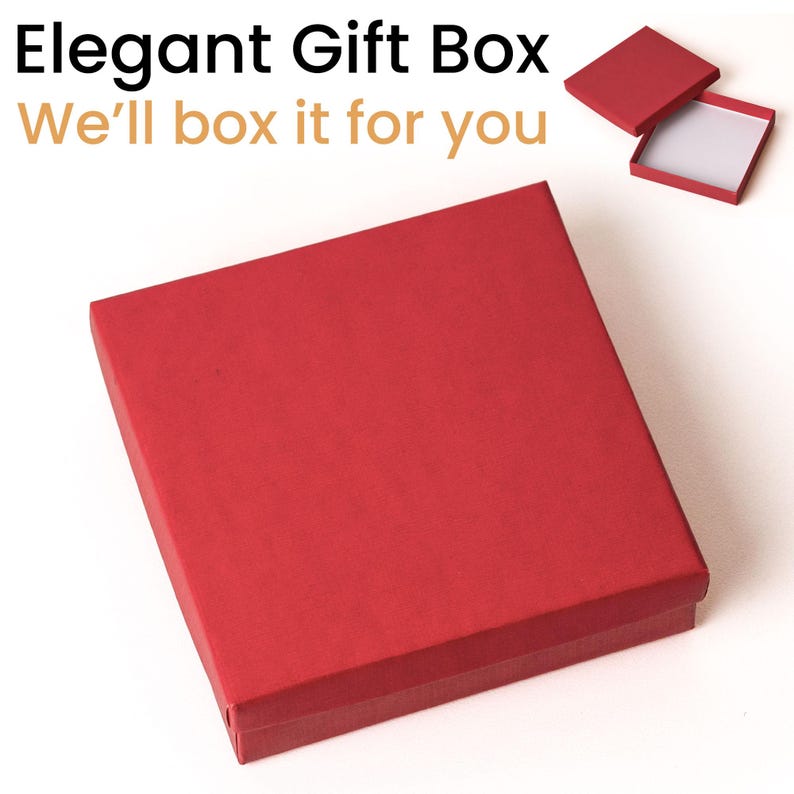 May include: A red gift box with a matching lid, set against a white background. The box is square and has a simple, elegant design. Text at the top reads "Elegant Gift Box" and "We'll box it for you".