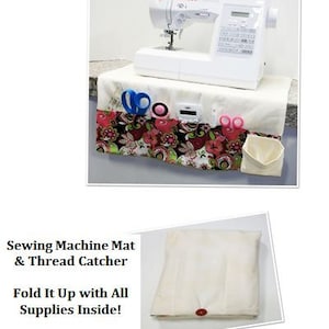 May include: A white Singer sewing machine sits atop a cream-colored mat with a floral border. The mat has pockets for sewing supplies, including scissors and a pin cushion. The text reads "Sewing Machine Mat & Thread Catcher".