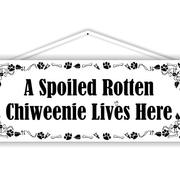 A spoiled rotten chiweenie lives here. 3.5" x 9" solid PVC sign. Weatherproof and can can be displayed on a wall or in the yard or planter.