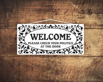 Welcome please check your politics at the door - Entry sign made of 1/8" x3.5" x 9" solid PVC. Hand made in the USA by Mysigncraft.