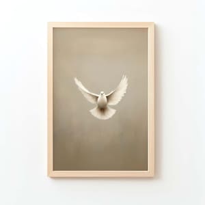 May include: A framed print featuring a white dove in flight against a muted beige background. The dove's wings are spread, and the artwork is encased in a light-colored wooden frame, creating a serene and minimalist aesthetic.