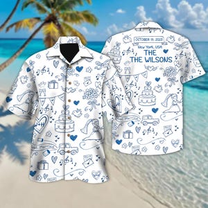 May include: White button-down shirt with a blue wedding-themed doodle pattern. The design includes wedding cakes, brides, hearts, and the text "Just Married." The back of the shirt has the text "October 19, 2025, New York, USA, The Wilsons."