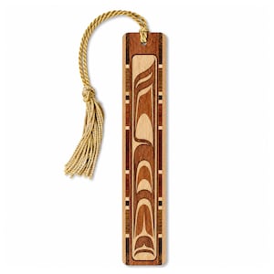 May include: A rectangular wooden bookmark featuring a vertical inlay design with light and dark wood tones. The center panel displays a stylized abstract graphic pattern. A gold-colored braided cord with a matching tassel is attached to the top.