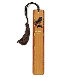 May include: Wooden bookmark featuring a Red-Tailed Hawk illustration. The bookmark has a brown tassel and a decorative border with inlaid wood accents. The text "Red-Tailed Hawk" is printed on the bookmark.
