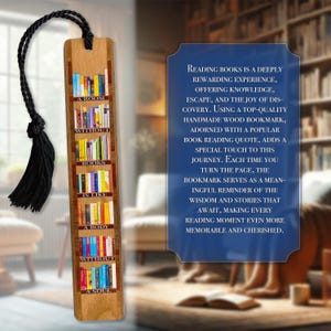 May include: A rectangular wooden bookmark featuring a printed illustration of colorful bookshelves and the text A ROOM WITHOUT BOOKS IS LIKE A BODY WITHOUT A SOUL. The bookmark includes a black braided cord with a matching black tassel at the top.
