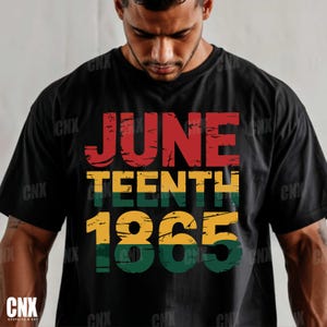 May include: Black t-shirt with the text "Juneteenth 1865" in red, yellow, and green.