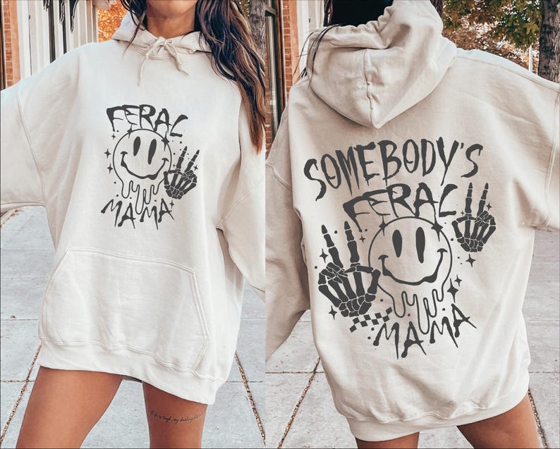 May include: A white hoodie with a black graphic print of a smiley face with dripping eyes and the text "Somebody's Ferac My Mama" on the back. The front of the hoodie has a similar graphic with the text "Ferac My Mama".