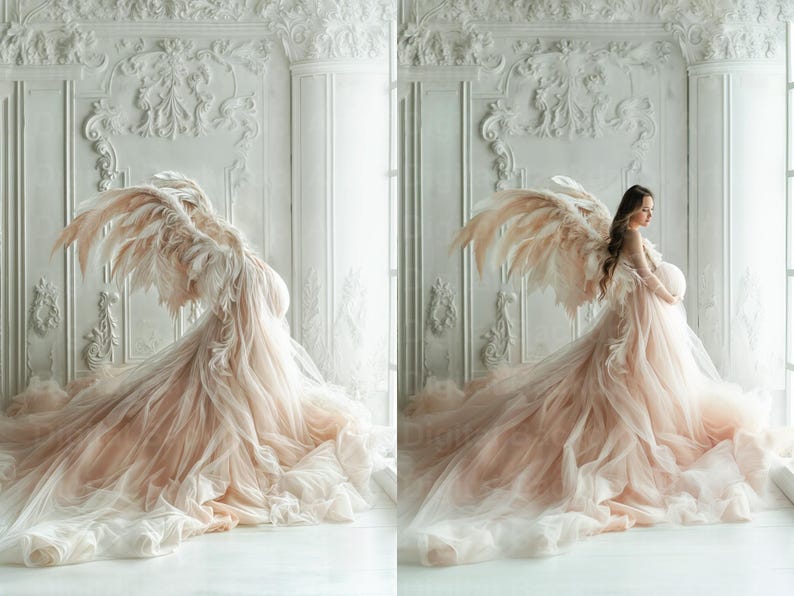 May include: A pregnant person wearing a flowing, blush-coloured tulle gown with large, feathery angel wings. The gown has a long train and the person is standing in front of a white, ornate wall.