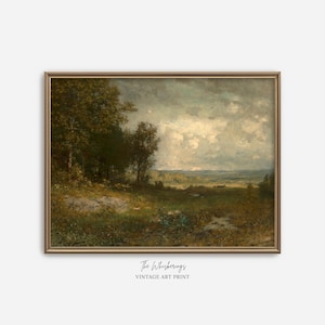 A giclèe art print of an antique oil painting, featuring a moody landscape. The painting shows a field with rolling hills in the distance, trees, and a mix of dark and grey clouds with sunlight peaking through to illuminate parts of the landscape.