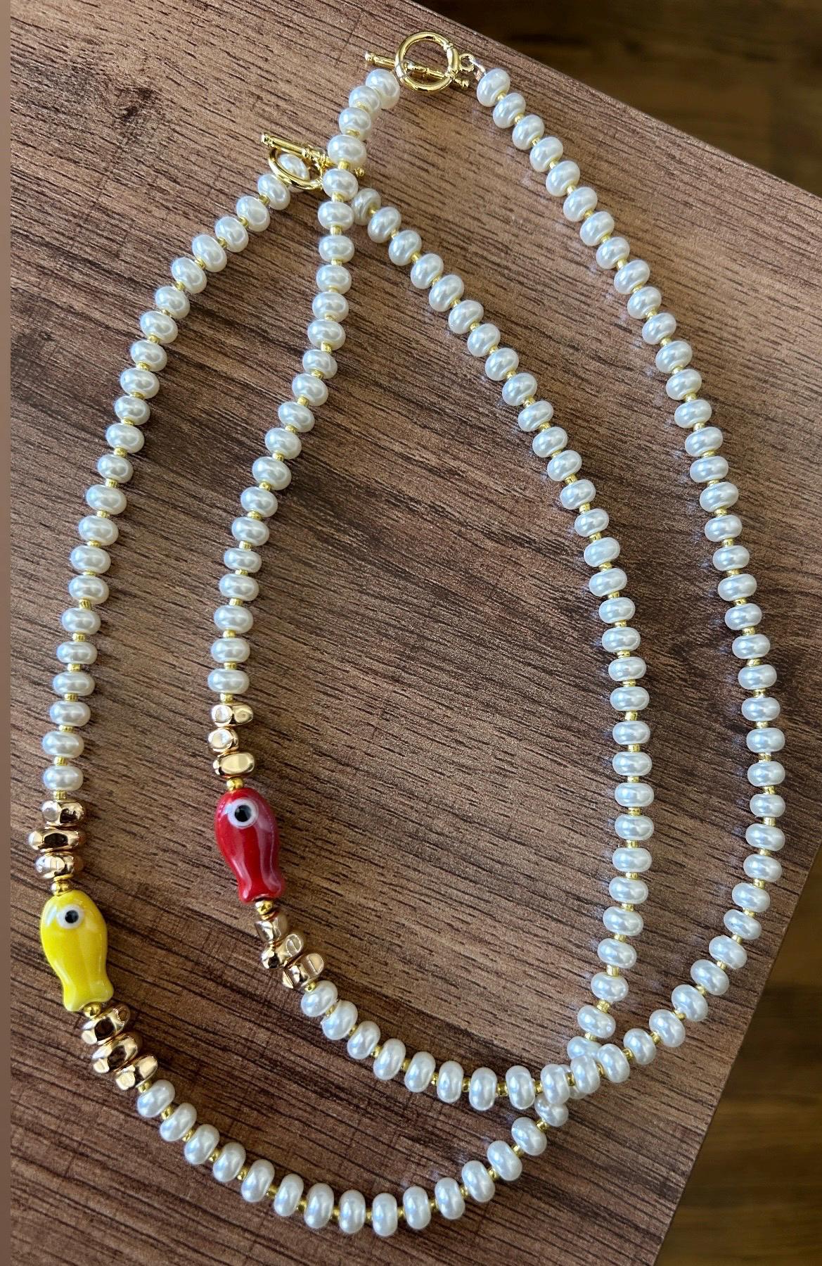 Glass pearl beaded necklace with fish bead and gold accent beads