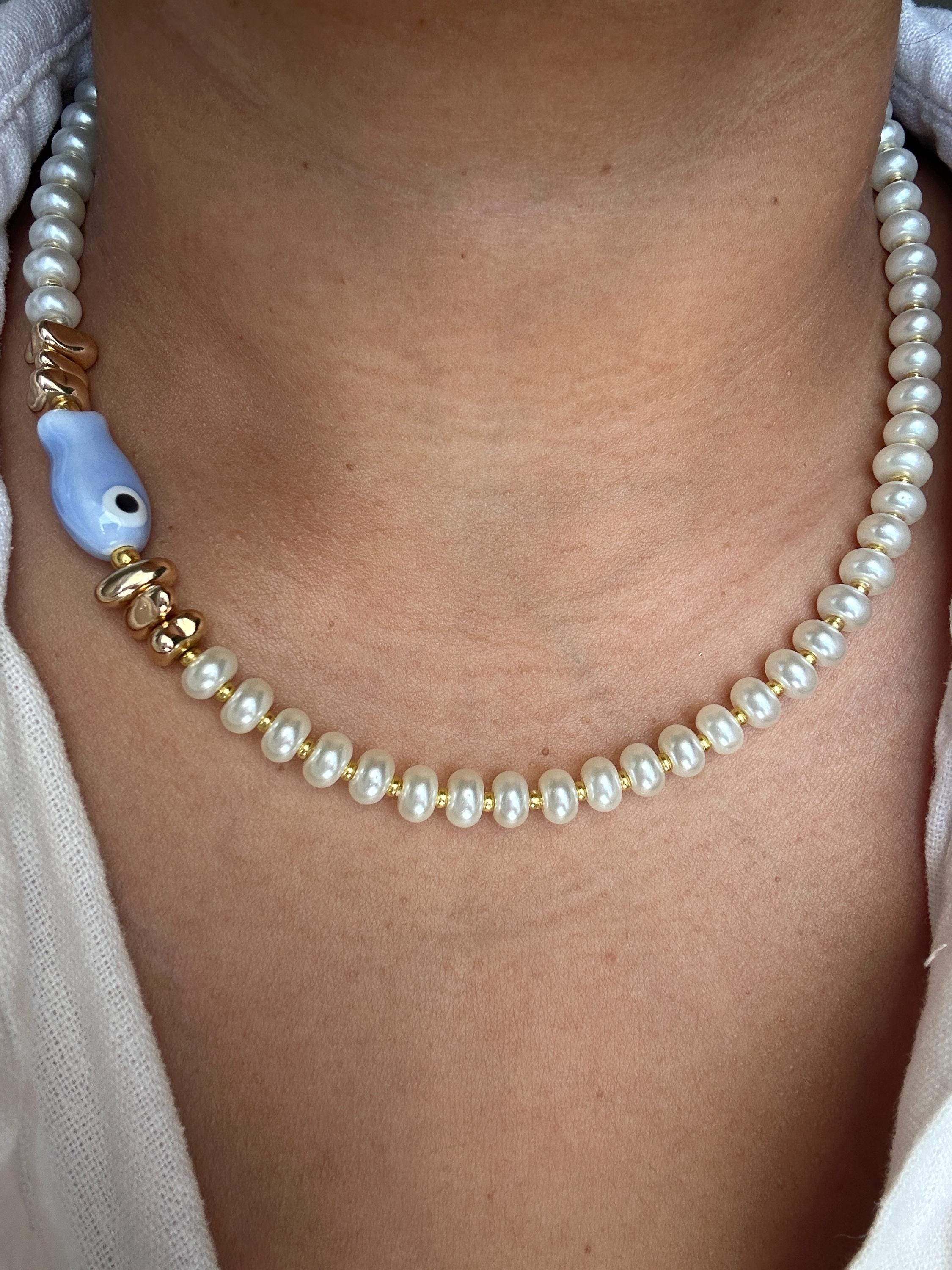 Glass pearl beaded necklace with fish bead and gold accent beads
