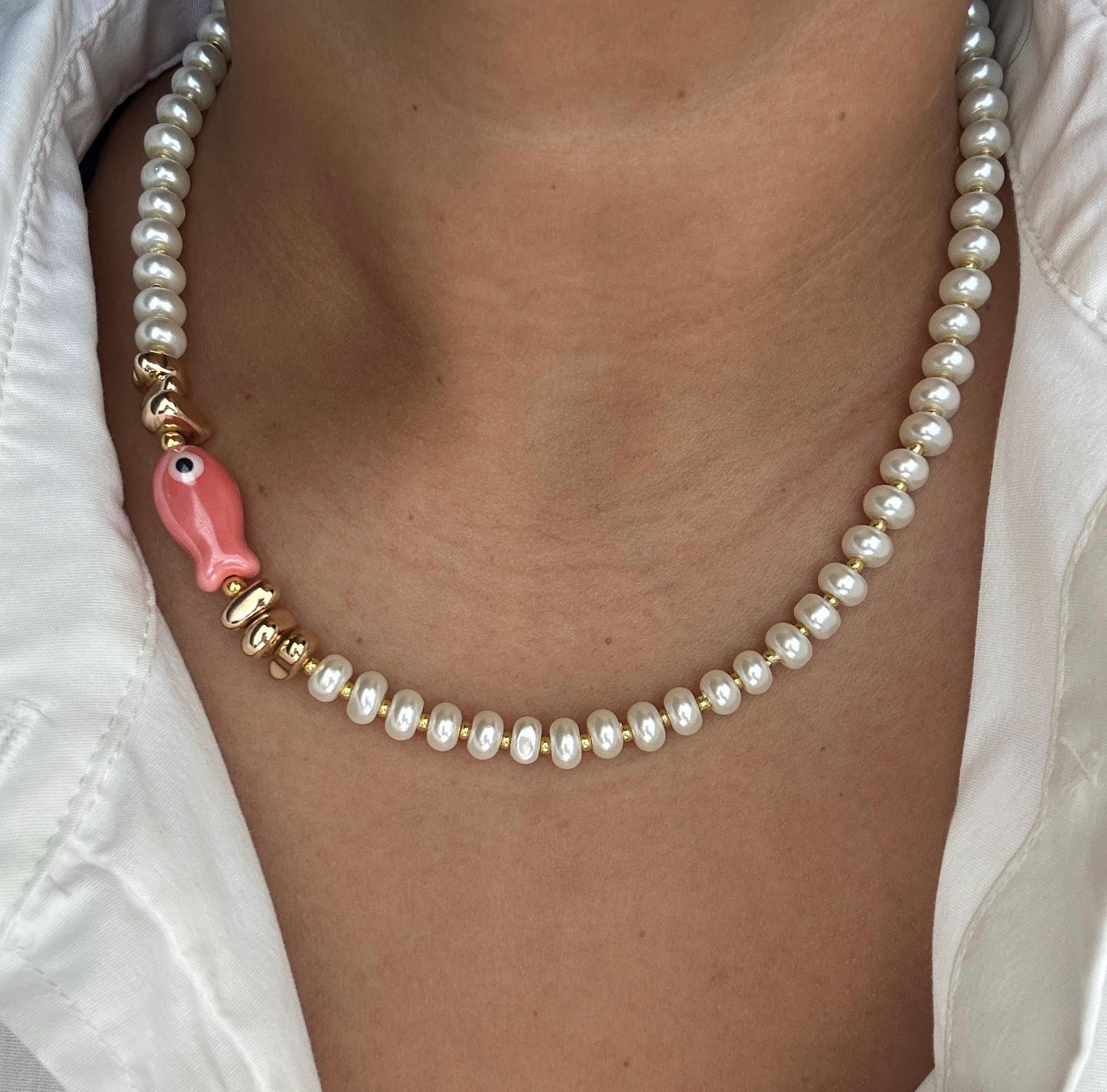 Glass pearl beaded necklace with fish bead and gold accent beads