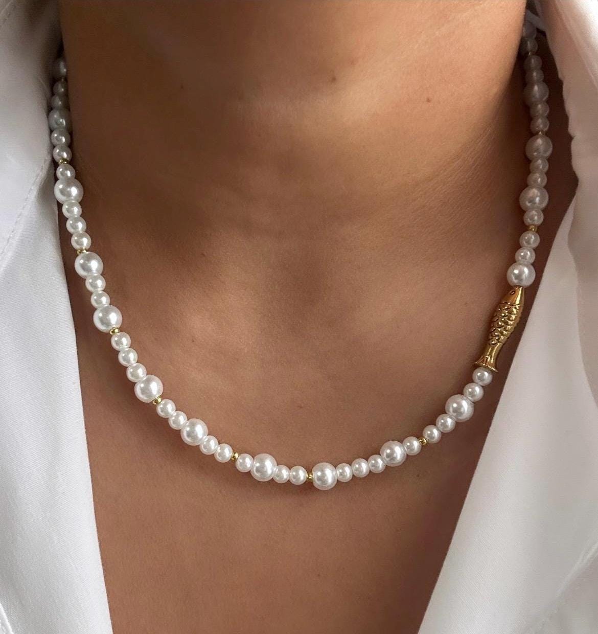 Glass pearl beaded necklace with gold fish bead and gold accent beads