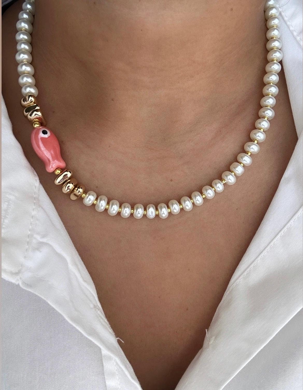 Glass pearl beaded necklace with fish bead and gold accent beads