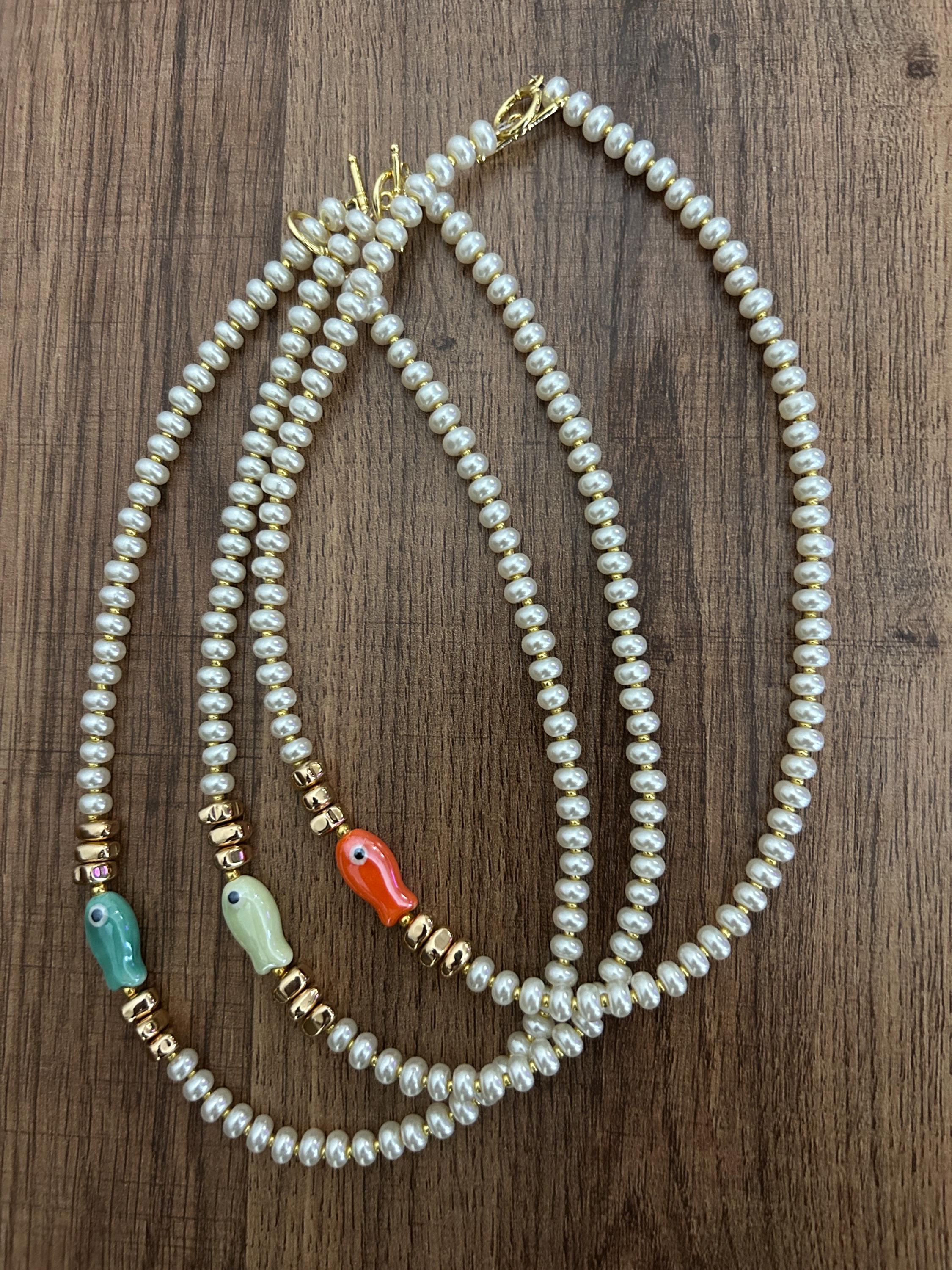 Glass pearl beaded necklace with fish bead and gold accent beads