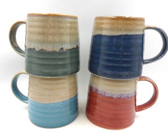 Set of 4 Reactive Glaze Creme Brulee Mugs in assorted seashore glazes.