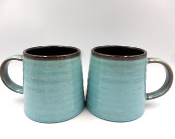Set of 2 Reactive Glaze Creme Brulee Mugs in Teal and dark chocolate.