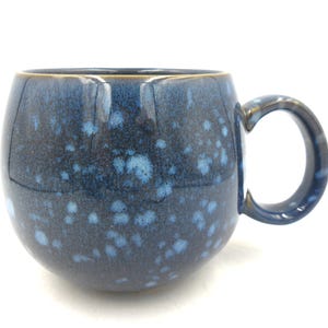 Individual Reactive Glaze Sphere Cuddle Mugs in Blue with Mottled white spots.