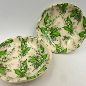 A pair of little petal dishes in Lily of the Valley design by Heron Cross Pottery