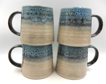 Set of 4 Reactive Glaze Creme Brulee Mugs in Blue Snake Eye Glazes.