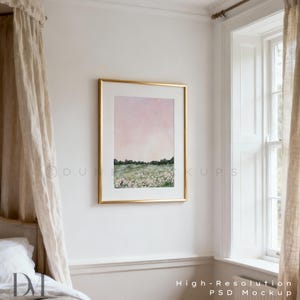 May include: A framed watercolor print with a gold frame hangs on a white wall. The artwork depicts a field of flowers under a pink and purple sky. The words "High-Resolution PSD Mockup" are at the bottom.