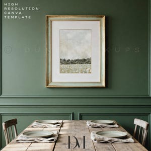 May include: A framed landscape art print with a gold and pale blue frame hangs above a wooden table set for a meal. The artwork depicts a field of flowers and trees under a cloudy sky. The text "HIGH RESOLUTION CANVA TEMPLATE" is in the upper left corner.