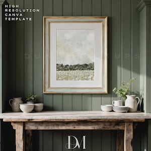 May include: A framed landscape art print with a gold and pale blue frame. The artwork shows a field of flowers and a distant treeline under a cloudy sky. The text "HIGH RESOLUTION CANVA TEMPLATE" is visible in the upper left corner.