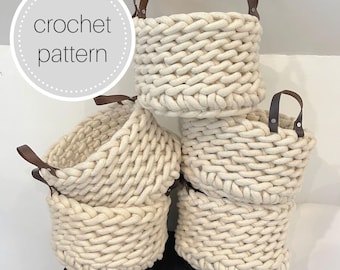 May include: A stack of five cream-colored crochet baskets with brown leather handles. The baskets are round and have a thick, textured weave. The text "crochet pattern" is in a white circle in the upper left corner.