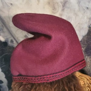 Phrygian hat, historically accurate, handmade inkle trim. Brown, red, green, burgundy wool, leather.
