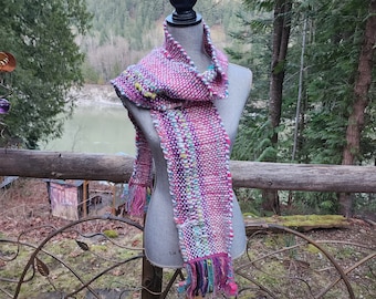 Handspun, hand dyed and woven multi coloured wool with colorful art yarn added.  Unique art scarf, creative weaving called Saori weaving.