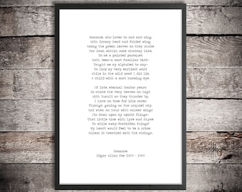 May include: Framed print featuring the poem "Romance" by Edgar Allan Poe. The text is in a classic serif font, centered on a white background, and enclosed in a black frame. The poem's title and author's name are at the bottom.