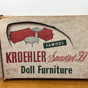 May include: Vintage Kroehler Smartset '59 doll furniture box. The box features a graphic of a red sofa, armchair, and tables. The text on the box reads "Kroehler Smartset '59 Doll Furniture" with the word "Famous" above the graphic.