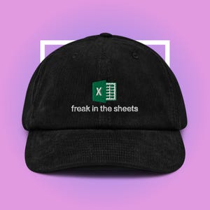 May include: Black corduroy baseball cap with an embroidered green Excel logo and the text "freak in the sheets".